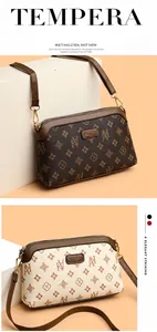 Detail view of the vintage monogram pattern and high-quality leather texture on women bag