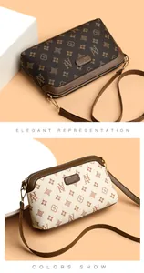 Detail view of stylish monogrammed crossbody bags in coffee and cream synthetic leather