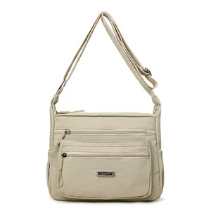 Beige Umhängetasche aus Nylon mit mehreren Reißverschlüssen und Gurt für Damen