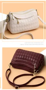 Detail view of stylish quilted faux leather handbags with gold zippers and hardware