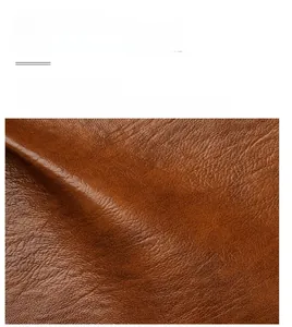Close-up macro view of high-quality brown leather material with natural texture