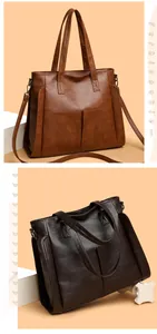 Detail of soft leather tote bag with vertical pockets and adjustable shoulder strap