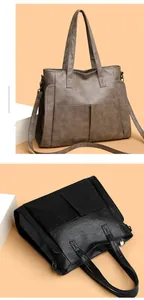 Detail showing pebbled texture leather tote bag with thin spaghetti straps and front pockets