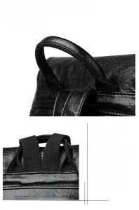 Detail of reinforced black leather handle and precise stitching on the fashion backpack