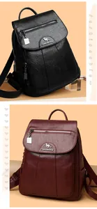 Detail of vintage PU leather backpacks in black and burgundy with kangaroo logo