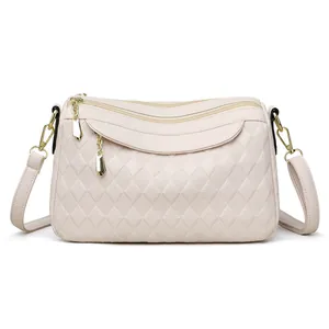 Elegant beige quilted leather shoulder bag for women with dual gold zippers and strap