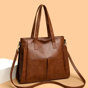 Caramel brown soft leather tote bag with large capacity and adjustable shoulder strap