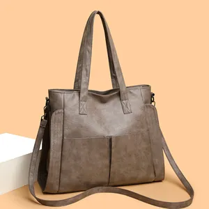 Large capacity vintage PU leather tote bag with wide handles and adjustable strap