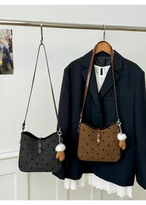 Detail of wool texture crossbody bags with velvet polka dots and cute bow patterns