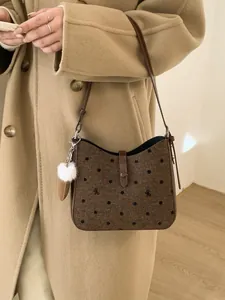 Retro brown polka dot felt crescent bag with bow embroidery and leather strap
