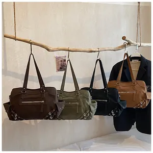 Detail view of four large-capacity canvas tote bags with metal buckles in autumn colors