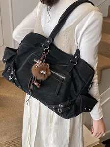 Black large capacity minimalist tote bag with utilitarian pockets and plush bear charm
