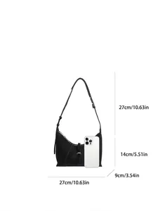 Minimalist black crescent shoulder bag with size chart and textured leather finish