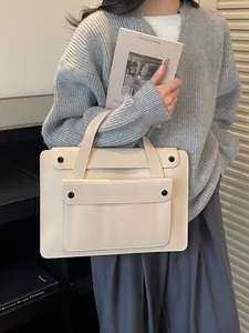 Elegant off-white faux leather tote bag for women featuring a minimalist front flap pocket
