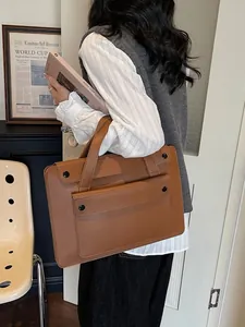 Brown leather large capacity vintage tote bag for women featuring a functional front pocket
