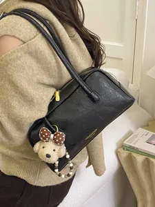 Retro black Boston shoulder bag with textured leather and cute teddy bear charm