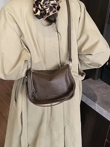 Brown leather crossbody bag with lychee texture and star charm for women in winter