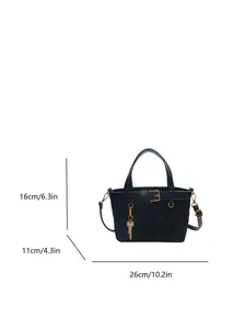 Minimalist black bucket bag with dimensions 26x16x11cm and gold key charm detail