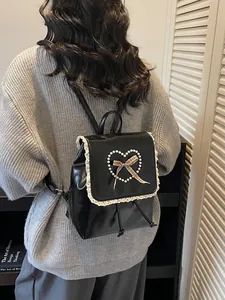 Chic black PU leather backpack with lace trim and pearl heart detail for women