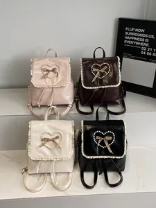 Lace trim mini backpacks with pearl heart detail in pink, brown, white and black colors