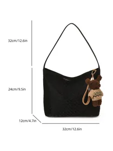 Minimalist woven tote bag in black leather with dimensions and bear charm detail