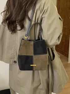 Vintage color block denim bucket bag in olive green and black patchwork design