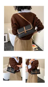 Détail du sac baguette en cuir rétro avec boucle dorée en G et bordures contrastées