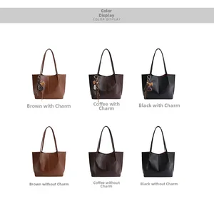 Detailed view of large tote bags in brown, coffee and black with heart tassel charms