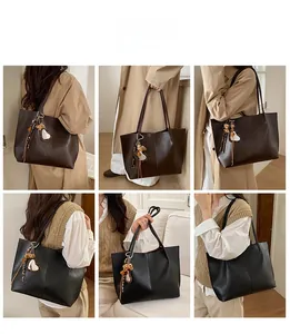 Lifestyle shots of large tote bag in black and brown with leopard heart charms