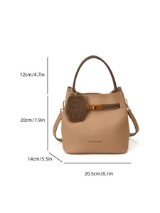 Khaki leather bucket bag with dimensions 20.5x20x14cm and bear charm pendant