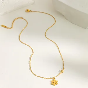 Detail of gold snowflake titanium necklace with adjustable chain and lobster clasp
