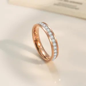 Minimalist rose gold titanium ring with sparkling single row of zircons for women