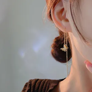 Elegant gold butterfly tassel earrings with long chain threader for a minimalist look