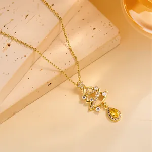 Gold Christmas tree necklace with white zircon stones and yellow teardrop pendant