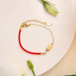 Red cord and gold chain bracelet with square bar and gold engraving for women