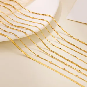Assorted gold plated stainless steel necklaces featuring curb and ball chain styles