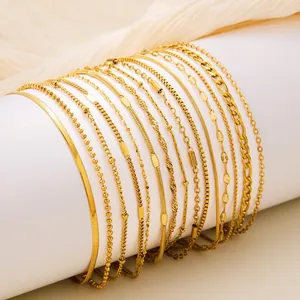 Set of 14 gold plated stainless steel chain necklaces featuring various links and textures