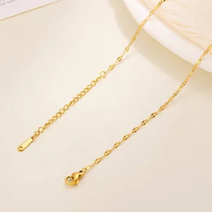 Close-up of 18k gold plated titanium steel chain with lobster clasp and extension