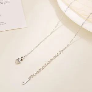 Close-up of stainless steel O-chain necklace with lobster clasp and S.STEEL engraved tag