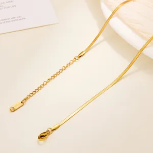 Detailed macro view of 18k gold plated titanium steel chain with lobster clasp and extender