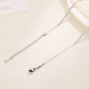 Detail of silver stainless steel snake chain with lobster clasp and extension
