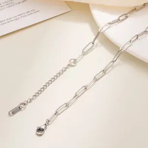 Detailed macro view of the stainless steel lobster clasp and chain with S.STEEL hallmark