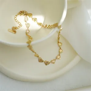 Elegant K18 gold-plated hollow heart chain necklace with radial pattern on white background