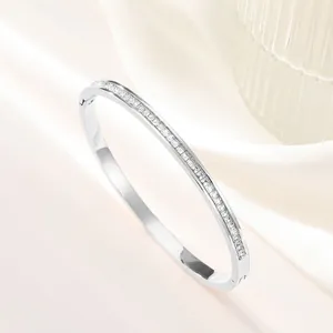 Macro detail of silver titanium steel bracelet with square cubic zirconia inlay