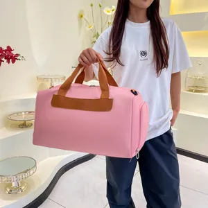 Pink large-capacity fitness bag with brown strap and dry-wet separation detail