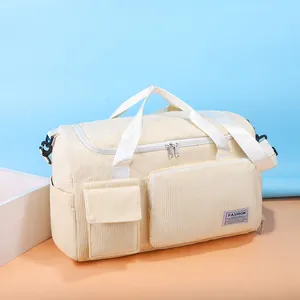 Large capacity corduroy travel bag in beige with adjustable shoulder strap for fitness