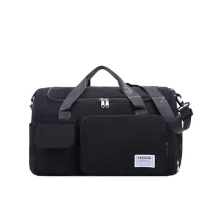 Black corduroy travel duffel bag with adjustable shoulder strap for gym and sports