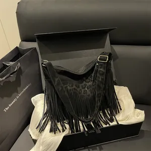 Large black suede tote bag with leopard print and long leather fringe details