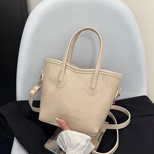 Chic beige textured faux leather tote bag with gold hardware and removable shoulder strap