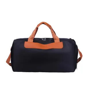 Large capacity black travel bag with tan straps and dry-wet separation features